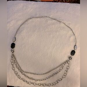Large silver chain necklace.